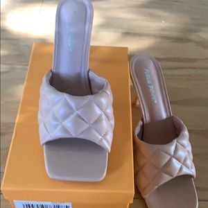 Public desire quilted mules